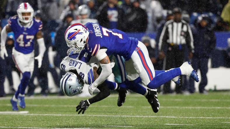 Buffalo Bills cornerback Taron Johnson (7) makes the tackle on Dallas Cowboys wide receiver CeeDee Lamb (88).