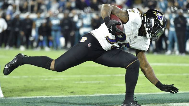 Baltimore Ravens running back Gus Edwards (35) goes into the end zone for an early fourth quarter touchdown. The Jacksonville Jaguars hosted the Baltimore Ravens at EverBank Stadium in Jacksonville, Florida Sunday Night, December 17, 2023. The Jaguars trailed 10 to 0 at the half and lost 23 to 7. [Bob Self/Florida Times-Union]