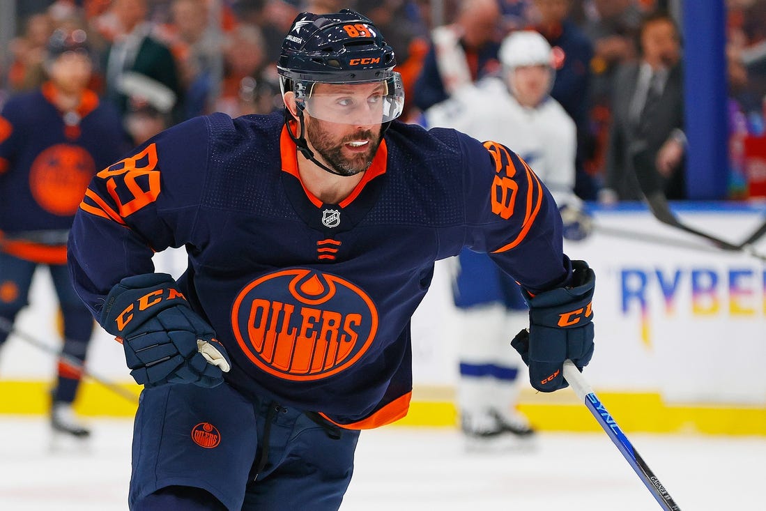 Dec 14, 2023; Edmonton, Alberta, CAN; Edmonton Oilers forward Sam Gagner (89) chases a loose puck against the Tampa Bay Lightning at Rogers Place. Mandatory Credit: Perry Nelson-USA TODAY Sports