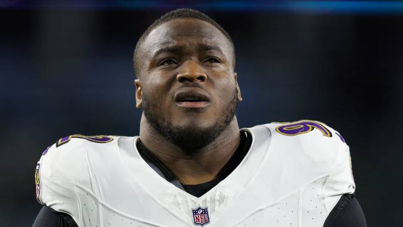 Dec 17, 2023; Jacksonville, Florida, USA;  Baltimore Ravens defensive tackle Justin Madubuike (92) warms up before a game against the Jacksonville Jaguars at EverBank Stadium. Mandatory Credit: Nathan Ray Seebeck-USA TODAY Sports