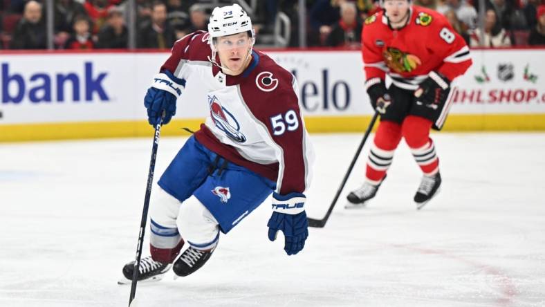 Dec 19, 2023; Chicago, Illinois, USA; Colorado Avalanche forward Ben Meyers (59) controls the puck in the first period against the Chicago Blackhawks at United Center. Mandatory Credit: Jamie Sabau-USA TODAY Sports