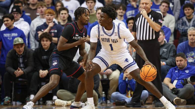 Dec 20, 2023; Newark, New Jersey, USA; Seton Hall Pirates guard Kadary Richmond (1) dribbles as Connecticut Huskies guard Tristen Newton (2) defends during the first half at Prudential Center. Mandatory Credit: Vincent Carchietta-USA TODAY Sports