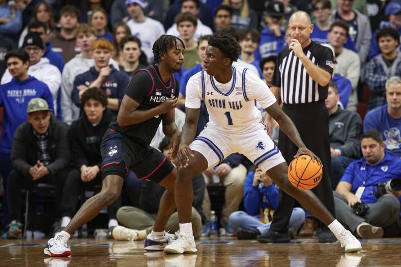 Dec 20, 2023; Newark, New Jersey, USA; Seton Hall Pirates guard Kadary Richmond (1) dribbles as Connecticut Huskies guard Tristen Newton (2) defends during the first half at Prudential Center. Mandatory Credit: Vincent Carchietta-USA TODAY Sports