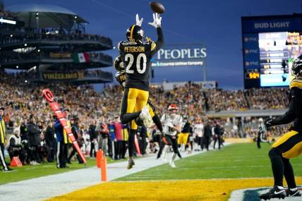 Dec 23, 2023; Pittsburgh, PA, USA; Pittsburgh Steelers cornerback Patrick Peterson (20) intercepts a pass in the first quarter during a Week 16 NFL football game between the Cincinnati Bengals and the Pittsburgh Steelers at Acrisure Stadium. Mandatory Credit: Kareem Elgazzar-USA TODAY Sports