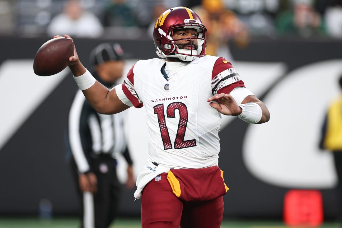 Dec 24, 2023; East Rutherford, New Jersey, USA; Washington Commanders quarterback Jacoby Brissett (12) throws the ball during the second half against the New York Jets at MetLife Stadium. Mandatory Credit: Vincent Carchietta-USA TODAY Sports