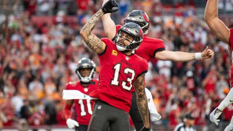 Dec 24, 2023; Tampa, Florida, USA; Tampa Bay Buccaneers wide receiver Mike Evans (13) celebrates the touchdown against the Jacksonville Jaguars in the second quarter at Raymond James Stadium. Mandatory Credit: Jeremy Reper-USA TODAY Sports