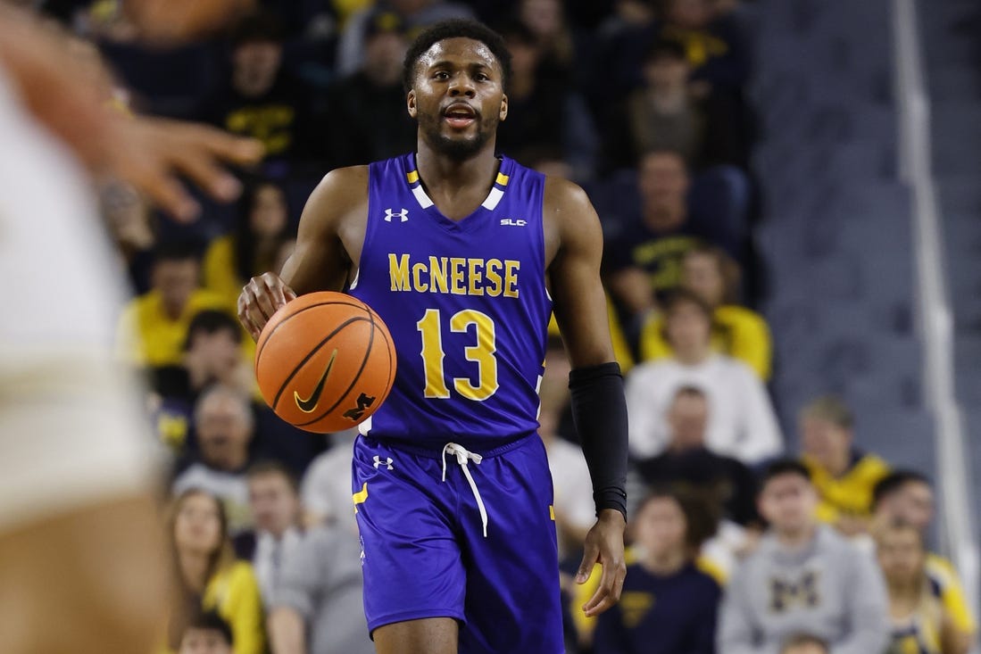 Dec 29, 2023; Ann Arbor, Michigan, USA;  McNeese State Cowboys guard Shahada Wells (13) dribbles in the second half against the Michigan Wolverines at Crisler Center. Mandatory Credit: Rick Osentoski-USA TODAY Sports