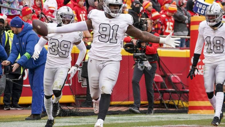 Dec 25, 2023; Kansas City, Missouri, USA; Las Vegas Raiders defensive tackle Bilal Nichols (91) celebrates after recovering a fumble to score against the Kansas City Chiefs during the game at GEHA Field at Arrowhead Stadium. Mandatory Credit: Denny Medley-USA TODAY Sports