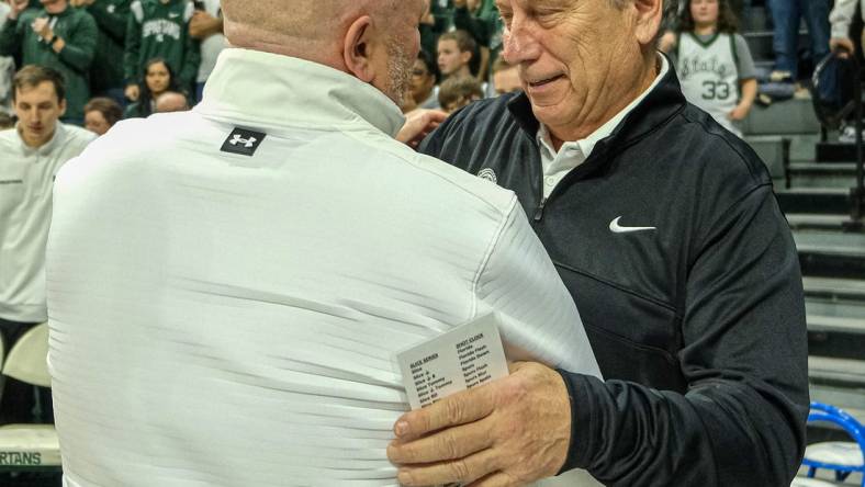 Michigan State coach Tom Izzo pictured greeting Indiana State coach Josh Schertz before the start of the game at the Breslin Center Saturday, Dec. 30, 2023.