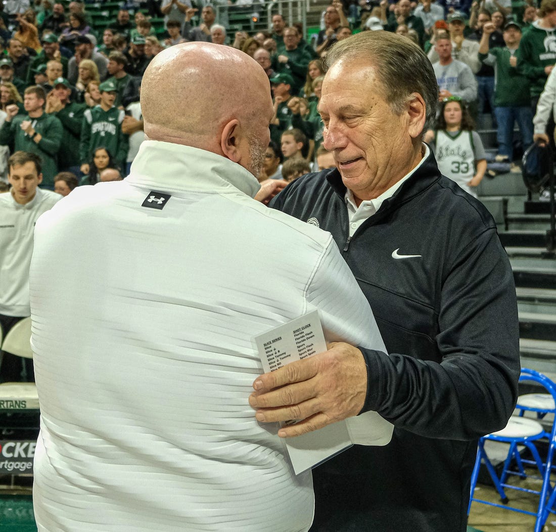 Michigan State coach Tom Izzo pictured greeting Indiana State coach Josh Schertz before the start of the game at the Breslin Center Saturday, Dec. 30, 2023.