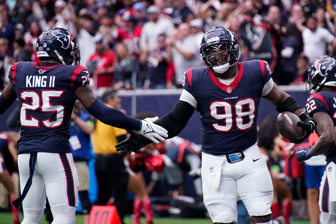 Houston Texans defensive tackle Sheldon Rankins (98) celebrates his touchdown off a ball fumbled by Tennessee Titans quarterback Will Levis during the second quarter at NRG Stadium in Houston, Texas., Sunday, Dec. 31, 2023.