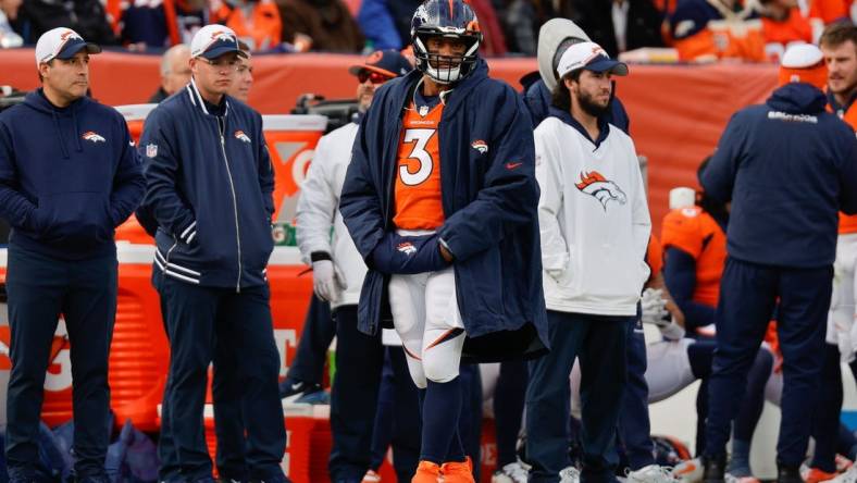 Dec 31, 2023; Denver, Colorado, USA; Denver Broncos quarterback Russell Wilson (3) looks on from the sideline in the first quarter against the Los Angeles Chargers at Empower Field at Mile High. Mandatory Credit: Isaiah J. Downing-USA TODAY Sports