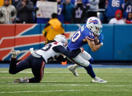 Buffalo Bills wide receiver Khalil Shakir (10) is tackled by New England Patriots safety Kyle Dugger (23) after a catch.
