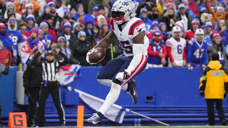 Dec 31, 2023; Orchard Park, New York, USA; New England Patriots running back Ezekiel Elliott (15) reacts to scoring a touchdown against the Buffalo Bills during the second half at Highmark Stadium. Mandatory Credit: Gregory Fisher-USA TODAY Sports