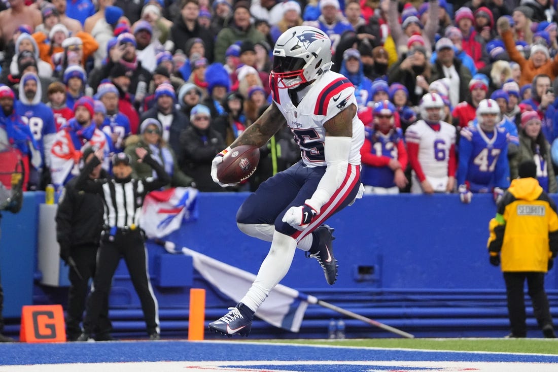 Dec 31, 2023; Orchard Park, New York, USA; New England Patriots running back Ezekiel Elliott (15) reacts to scoring a touchdown against the Buffalo Bills during the second half at Highmark Stadium. Mandatory Credit: Gregory Fisher-USA TODAY Sports