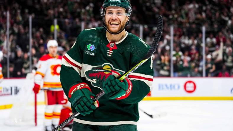 Jan 2, 2024; Saint Paul, Minnesota, USA; Minnesota Wild defenseman Dakota Mermis (6) celebrates a goal scored by left wing Pat Maroon (not pictured) during the second period against the Calgary Flames at Xcel Energy Center. Mandatory Credit: Brace Hemmelgarn-USA TODAY Sports