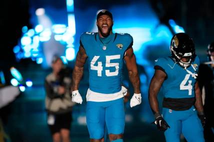 Jacksonville Jaguars linebacker K'Lavon Chaisson (45) yells during the team introduction before a regular season NFL football matchup Sunday, Dec. 17, 2023 at EverBank Stadium in Jacksonville, Fla. The Baltimore Ravens defeated the Jacksonville Jaguars 23-7.