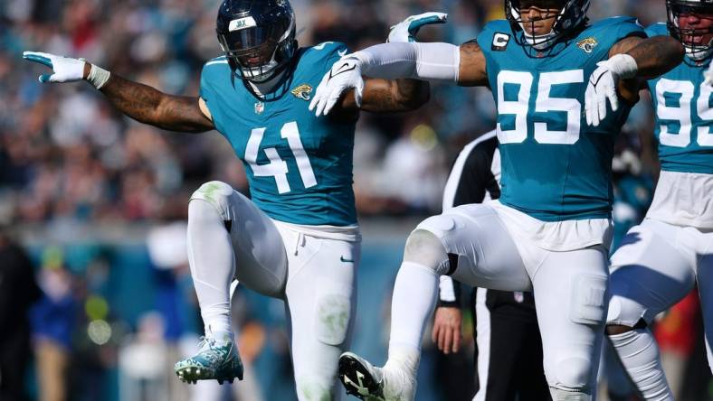 Jacksonville Jaguars linebacker Josh Allen (41) celebrates with teammates after setting the Jaguars single season record for sacks during second quarter action. The Jacksonville Jaguars hosted the Carolina Panthers at EverBank Stadium in Jacksonville, FL Sunday, December 31, 2023. The Jaguars went in at the half with a 9 to 0 lead.