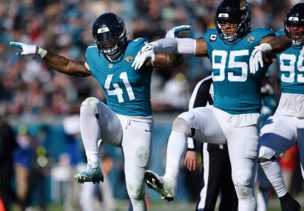 Jacksonville Jaguars linebacker Josh Allen (41) celebrates with teammates after setting the Jaguars single season record for sacks during second quarter action. The Jacksonville Jaguars hosted the Carolina Panthers at EverBank Stadium in Jacksonville, FL Sunday, December 31, 2023. The Jaguars went in at the half with a 9 to 0 lead.