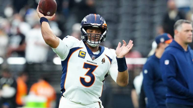 Jan 7, 2024; Paradise, Nevada, USA; Denver Broncos quarterback Russell Wilson (3) warms up before a game against the Las Vegas Raiders at Allegiant Stadium. Mandatory Credit: Stephen R. Sylvanie-USA TODAY Sports