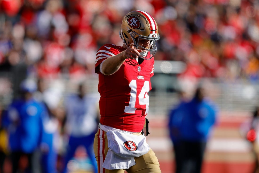 Jan 7, 2024; Santa Clara, California, USA; San Francisco 49ers quarterback Sam Darnold (14) celebrates after a play during the second quarter against the Los Angeles Rams at Levi's Stadium. Mandatory Credit: Sergio Estrada-USA TODAY Sports