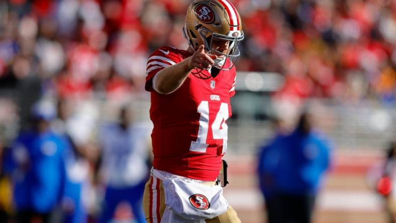 Jan 7, 2024; Santa Clara, California, USA; San Francisco 49ers quarterback Sam Darnold (14) celebrates after a play during the second quarter against the Los Angeles Rams at Levi's Stadium. Mandatory Credit: Sergio Estrada-USA TODAY Sports