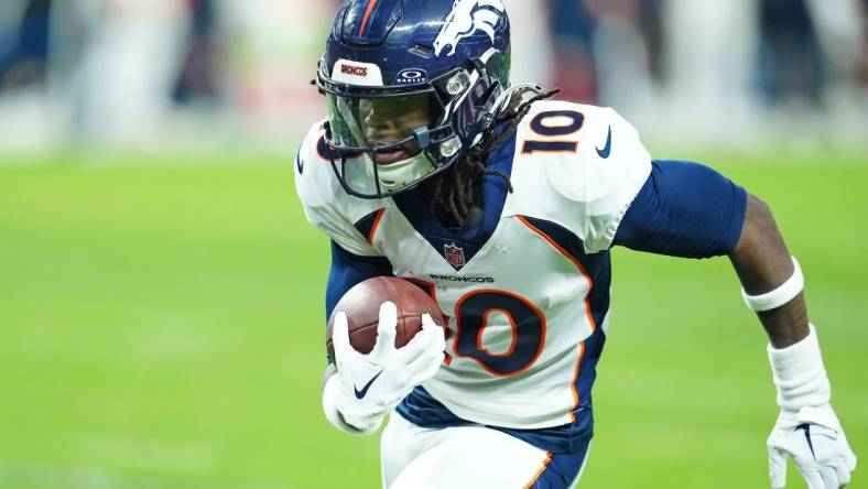 Jan 7, 2024; Paradise, Nevada, USA; Denver Broncos wide receiver Jerry Jeudy (10) gains yardage against the Las Vegas Raiders during the fourth quarter at Allegiant Stadium. Mandatory Credit: Stephen R. Sylvanie-USA TODAY Sports