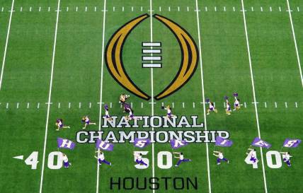 Jan 8, 2024; Houston, TX, USA; A general view as the Washington Huskies take the field before to the 2024 College Football Playoff national championship game at NRG Stadium. Mandatory Credit: James Lang-USA TODAY Sports