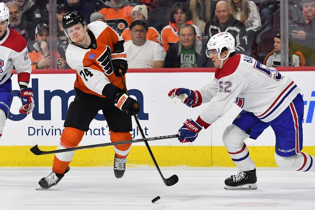 Jan 10, 2024; Philadelphia, Pennsylvania, USA; Philadelphia Flyers right wing Owen Tippett (74) takes a shot on goal against Montreal Canadiens defenseman Justin Barron (52) during third period at Wells Fargo Center. Mandatory Credit: Eric Hartline-USA TODAY Sports