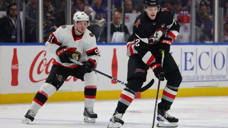 Jan 11, 2024; Buffalo, New York, USA;  Buffalo Sabres right wing Tage Thompson (72) looks to make a pass as Ottawa Senators right wing Vladimir Tarasenko (91) defends during the second period at KeyBank Center. Mandatory Credit: Timothy T. Ludwig-USA TODAY Sports