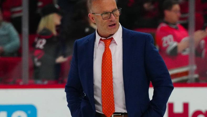 Jan 11, 2024; Raleigh, North Carolina, USA; Anaheim Ducks head coach Greg Cronin walks off the ice after the Ducks loss to the Carolina Hurricanes at PNC Arena. Mandatory Credit: James Guillory-USA TODAY Sports