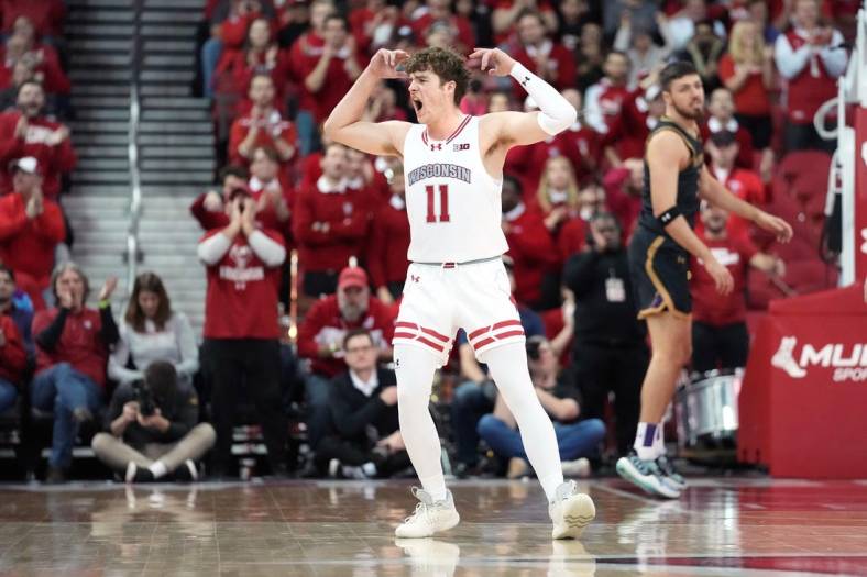 Jan 13, 2024; Madison, Wisconsin, USA; Wisconsin Badgers guard Max Klesmit (11) gestures making a three point basket during the second half at the Kohl Center. Mandatory Credit: Kayla Wolf-USA TODAY Sports