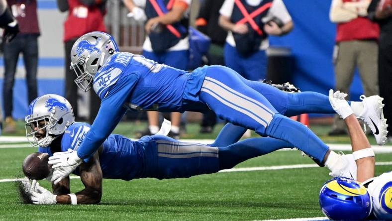 Jan 14, 2024; Detroit, Michigan, USA; Detroit Lions cornerback Cameron Sutton (1) and linebacker Jalen Reeves-Maybin (42) break up a pass during the first half of a 2024 NFC wild card game against the Los Angeles Rams at Ford Field. Mandatory Credit: Lon Horwedel-USA TODAY Sports