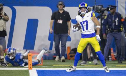 Jan 14, 2024; Detroit, Michigan, USA; Los Angeles Rams wide receiver Puka Nacua (17) scores a touchdown against Detroit Lions safety C.J. Gardner-Johnson (2) during the first half of a 2024 NFC wild card game at Ford Field. Mandatory Credit: David Reginek-USA TODAY Sports