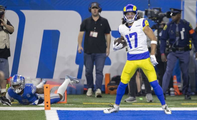 Jan 14, 2024; Detroit, Michigan, USA; Los Angeles Rams wide receiver Puka Nacua (17) scores a touchdown against Detroit Lions safety C.J. Gardner-Johnson (2) during the first half of a 2024 NFC wild card game at Ford Field. Mandatory Credit: David Reginek-USA TODAY Sports