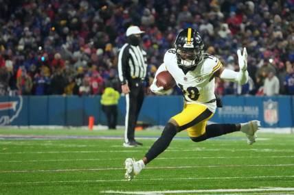 Jan 15, 2024; Orchard Park, New York, USA; Pittsburgh Steelers wide receiver Diontae Johnson (18) runs the ball in the second half against the Buffalo Bills in a 2024 AFC wild card game at Highmark Stadium. Mandatory Credit: Kirby Lee-USA TODAY Sports