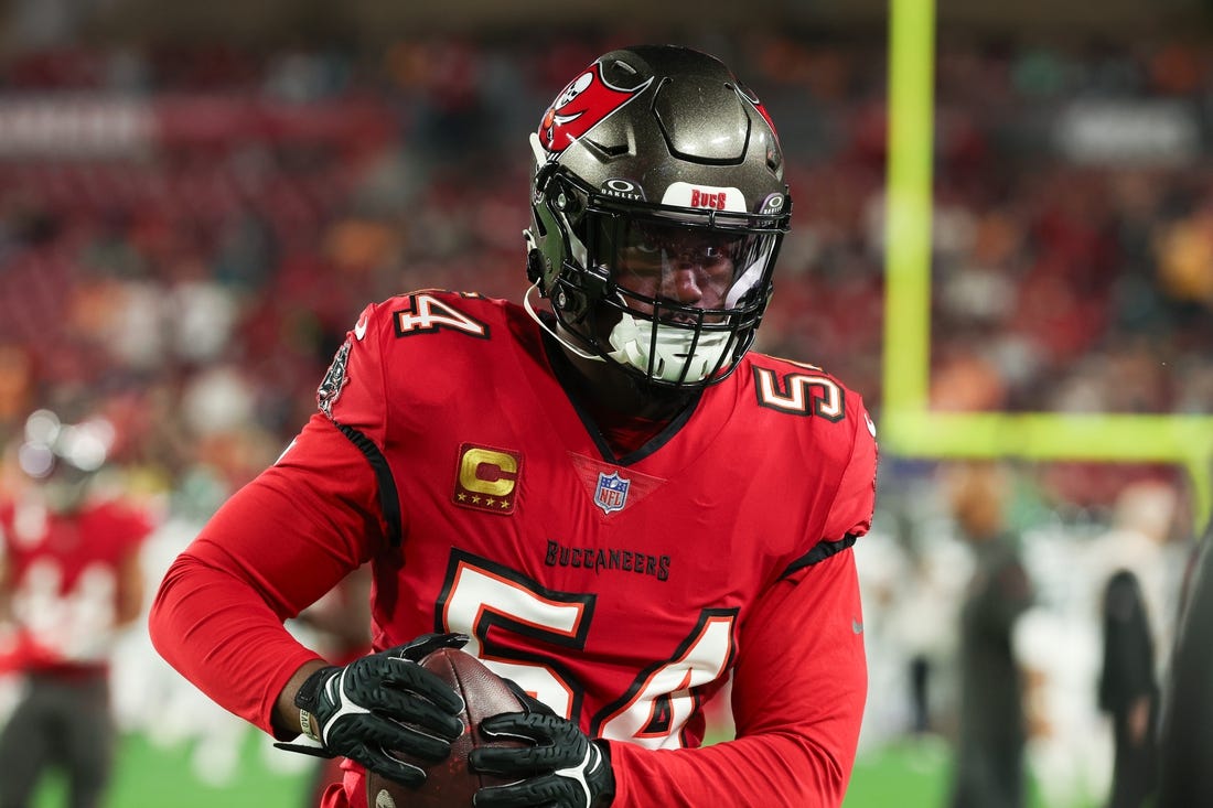 Jan 15, 2024; Tampa, Florida, USA; Tampa Bay Buccaneers linebacker Lavonte David (54) carries the ball during warm ups before a 2024 NFC wild card game against the Philadelphia Eagles at Raymond James Stadium. Mandatory Credit: Kim Klement Neitzel-USA TODAY Sports