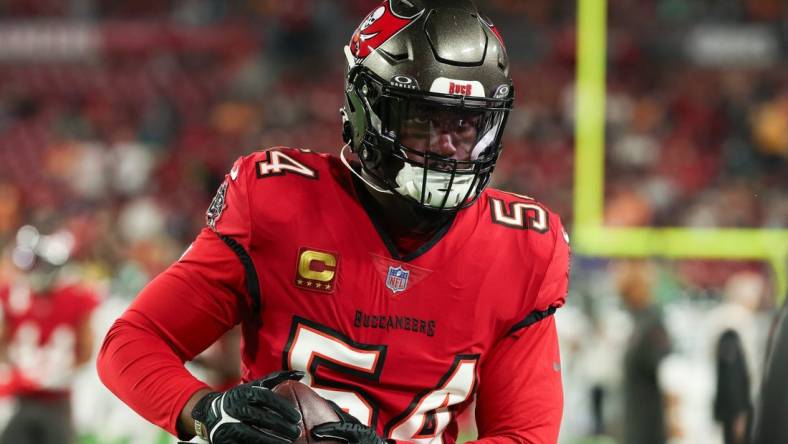 Jan 15, 2024; Tampa, Florida, USA; Tampa Bay Buccaneers linebacker Lavonte David (54) carries the ball during warm ups before a 2024 NFC wild card game against the Philadelphia Eagles at Raymond James Stadium. Mandatory Credit: Kim Klement Neitzel-USA TODAY Sports