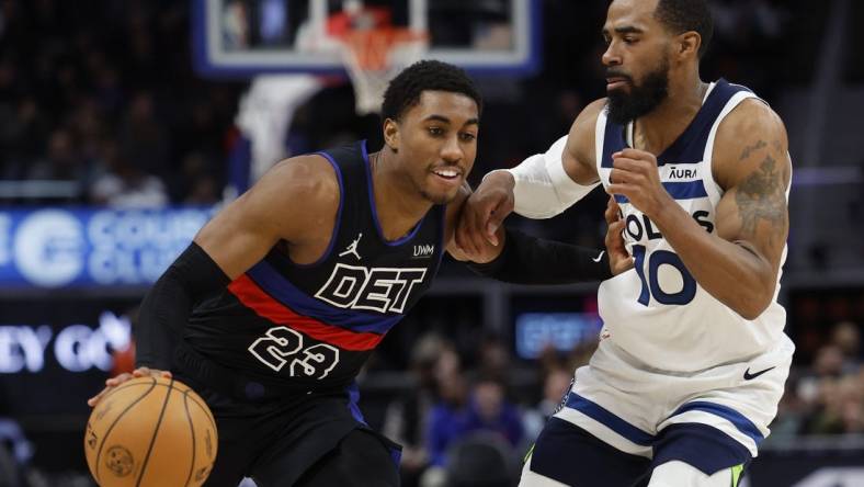 Jan 17, 2024; Detroit, Michigan, USA; Detroit Pistons guard Jaden Ivey (23) dribbles defended by Minnesota Timberwolves guard Mike Conley (10) in the second half at Little Caesars Arena. Mandatory Credit: Rick Osentoski-USA TODAY Sports