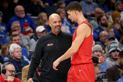 Jan 7, 2024; Memphis, Tennessee, USA; Southern Methodist Mustangs head coach Rob Lanier (left) talks with forward Samuell Williamson (10) during the first half against the Memphis Tigers at FedExForum. Mandatory Credit: Petre Thomas-USA TODAY Sports