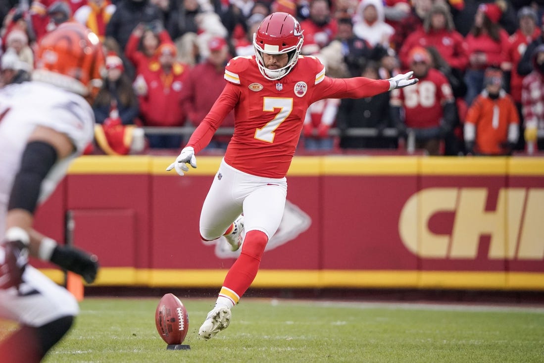 Dec 31, 2023; Kansas City, Missouri, USA; Kansas City Chiefs place kicker Harrison Butker (7) kicks the opening kickoff against the Cincinnati Bengals during the game at GEHA Field at Arrowhead Stadium. Mandatory Credit: Denny Medley-USA TODAY Sports