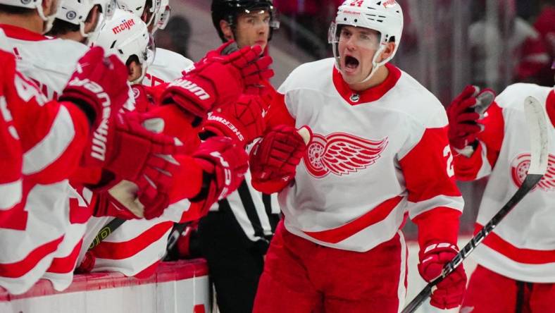 Jan 19, 2024; Raleigh, North Carolina, USA;  Detroit Red Wings center Klim Kostin (24) celebrates his goal against the Carolina Hurricanes during the first period at PNC Arena. Mandatory Credit: James Guillory-USA TODAY Sports