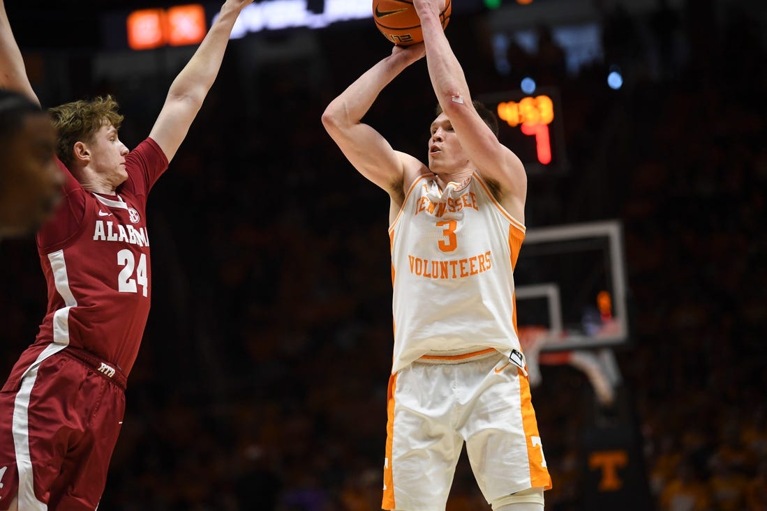 Tennessee guard Dalton Knecht (3) shoots the ball as Alabama forward Sam Walters (24) blocks during the NCAA game at Thompson-Boling Arena at Food City Center, Saturday, Jan. 20, 2024.