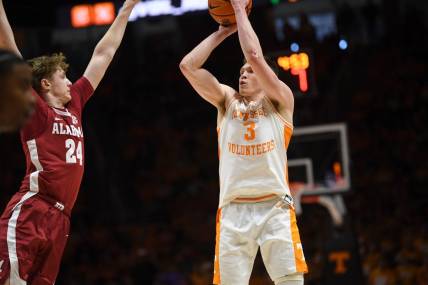 Tennessee guard Dalton Knecht (3) shoots the ball as Alabama forward Sam Walters (24) blocks during the NCAA game at Thompson-Boling Arena at Food City Center, Saturday, Jan. 20, 2024.