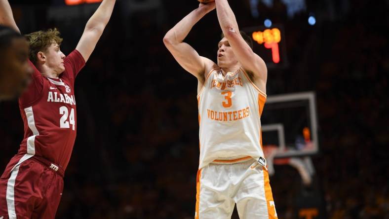 Tennessee guard Dalton Knecht (3) shoots the ball as Alabama forward Sam Walters (24) blocks during the NCAA game at Thompson-Boling Arena at Food City Center, Saturday, Jan. 20, 2024.