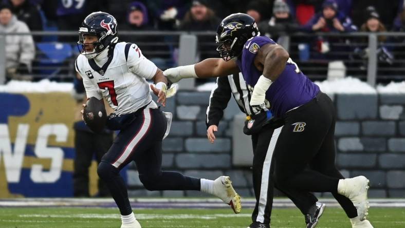 Jan 20, 2024; Baltimore, MD, USA; Houston Texans quarterback C.J. Stroud (7) runs the ball against Baltimore Ravens defensive tackle Justin Madubuike (92) during the first quarter of a 2024 AFC divisional round game at M&T Bank Stadium. Mandatory Credit: Tommy Gilligan-USA TODAY Sports