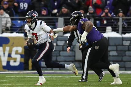 Jan 20, 2024; Baltimore, MD, USA; Houston Texans quarterback C.J. Stroud (7) runs the ball against Baltimore Ravens defensive tackle Justin Madubuike (92) during the first quarter of a 2024 AFC divisional round game at M&T Bank Stadium. Mandatory Credit: Tommy Gilligan-USA TODAY Sports