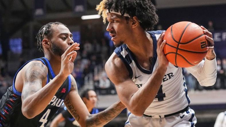 Butler Bulldogs guard DJ Davis (4) holds the ball from DePaul Blue Demons guard K.T. Raimey (4) on Saturday, Jan. 20, 2024, during the game at Hinkle Fieldhouse in Indianapolis. The Butler Bulldogs defeated the DePaul Blue Demons, 74-60.