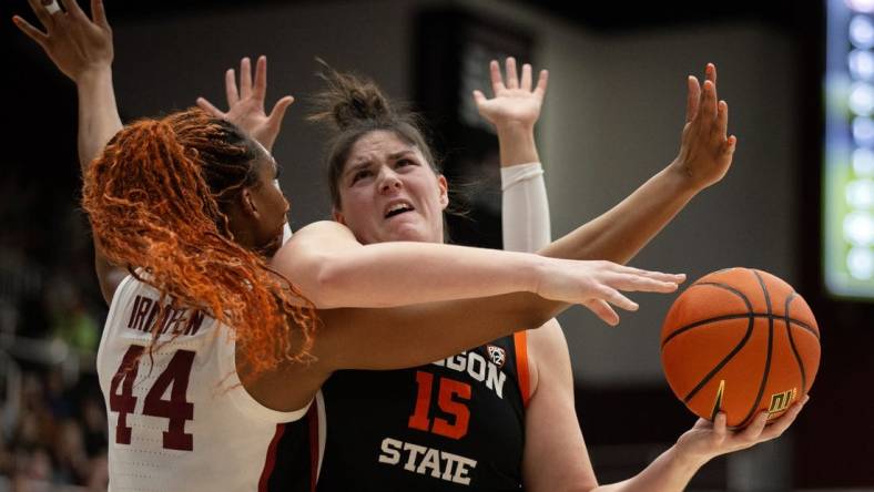 Jan 21, 2024; Stanford, California, USA; Oregon State Beavers forward Raegan Beers (15) tries to shoot over Stanford Cardinal forward Kiki Iriafen (44) during the first quarter at Maples Pavilion. Mandatory Credit: D. Ross Cameron-USA TODAY Sports