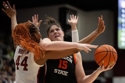 Jan 21, 2024; Stanford, California, USA; Oregon State Beavers forward Raegan Beers (15) tries to shoot over Stanford Cardinal forward Kiki Iriafen (44) during the first quarter at Maples Pavilion. Mandatory Credit: D. Ross Cameron-USA TODAY Sports